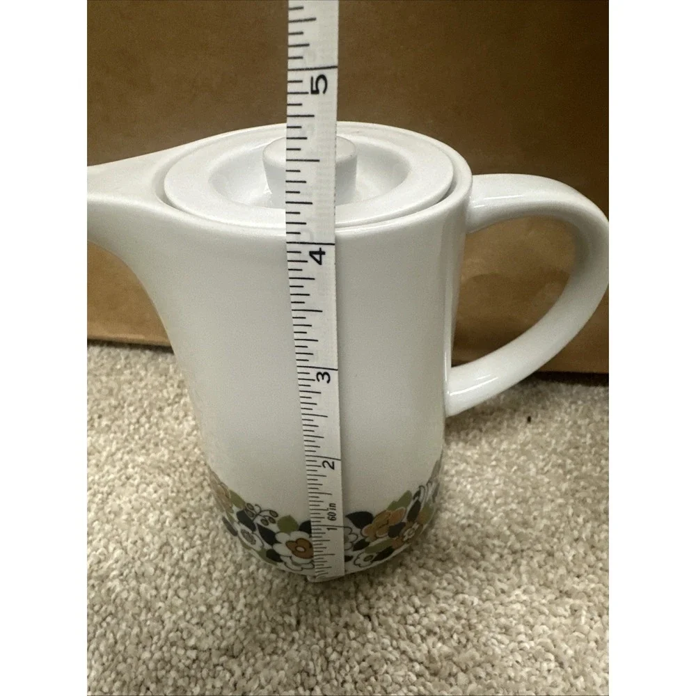 Vintage cream pitcher in the retro floral, manufactured by Suisse Langenthal